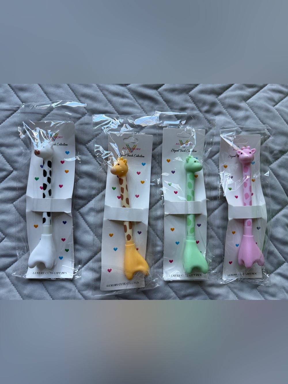 4 Giraffe ink pens in pink , Green, Yellow, White